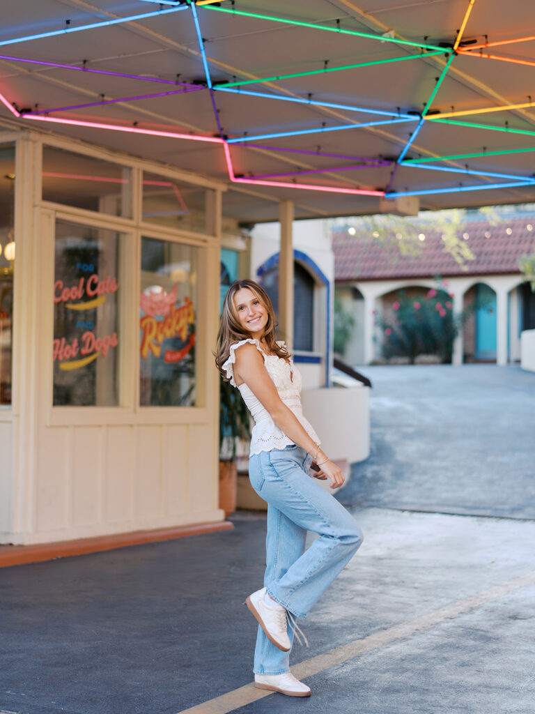 Joyful Austin senior photo on South Congress at golden hour on film