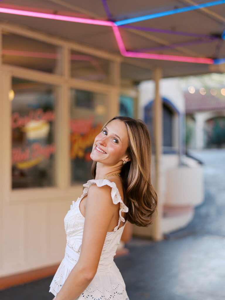 Joyful Austin senior photo on South Congress at golden hour on film