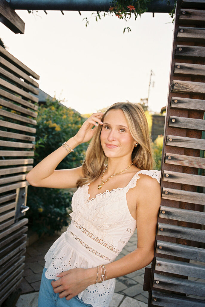 Joyful Austin senior photo on South Congress at golden hour on film