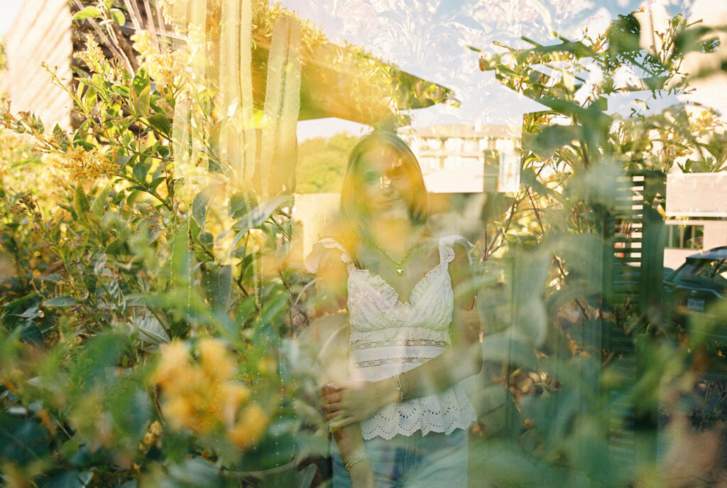 Joyful Austin senior photo on South Congress at golden hour on film