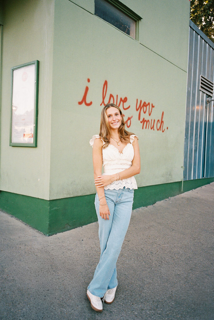Joyful Austin senior photo on South Congress at golden hour on film