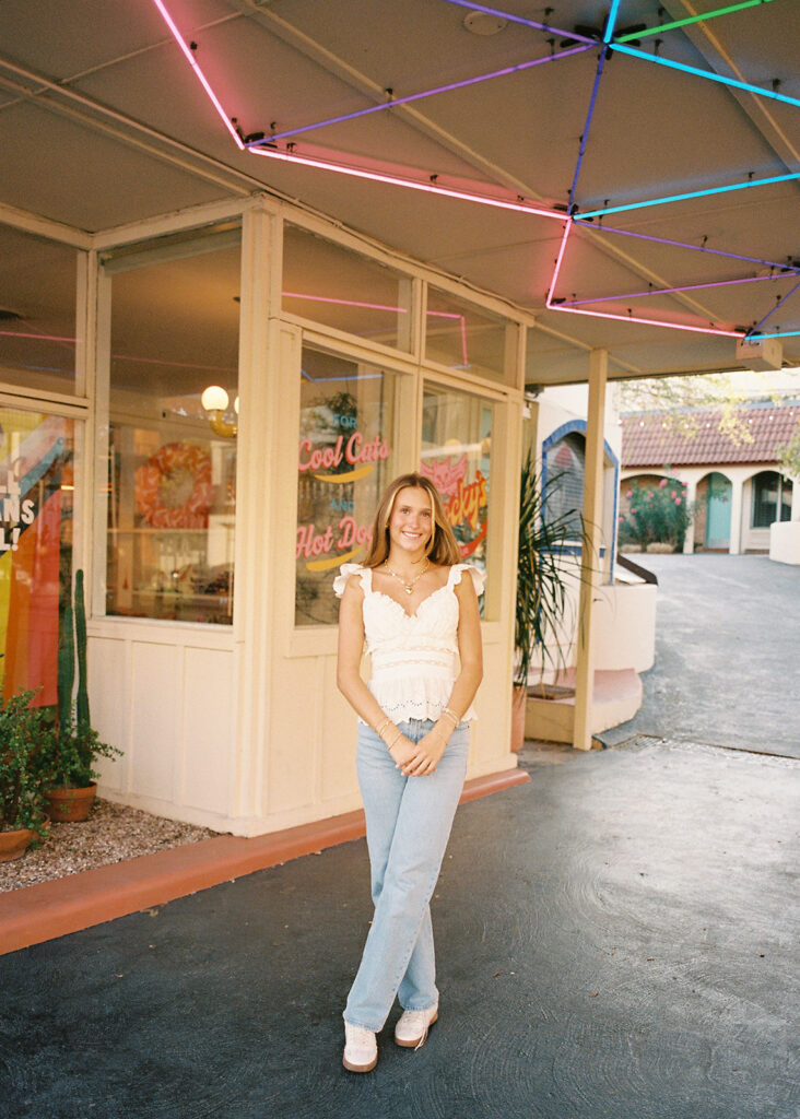 Joyful Austin senior photo on South Congress at golden hour on film