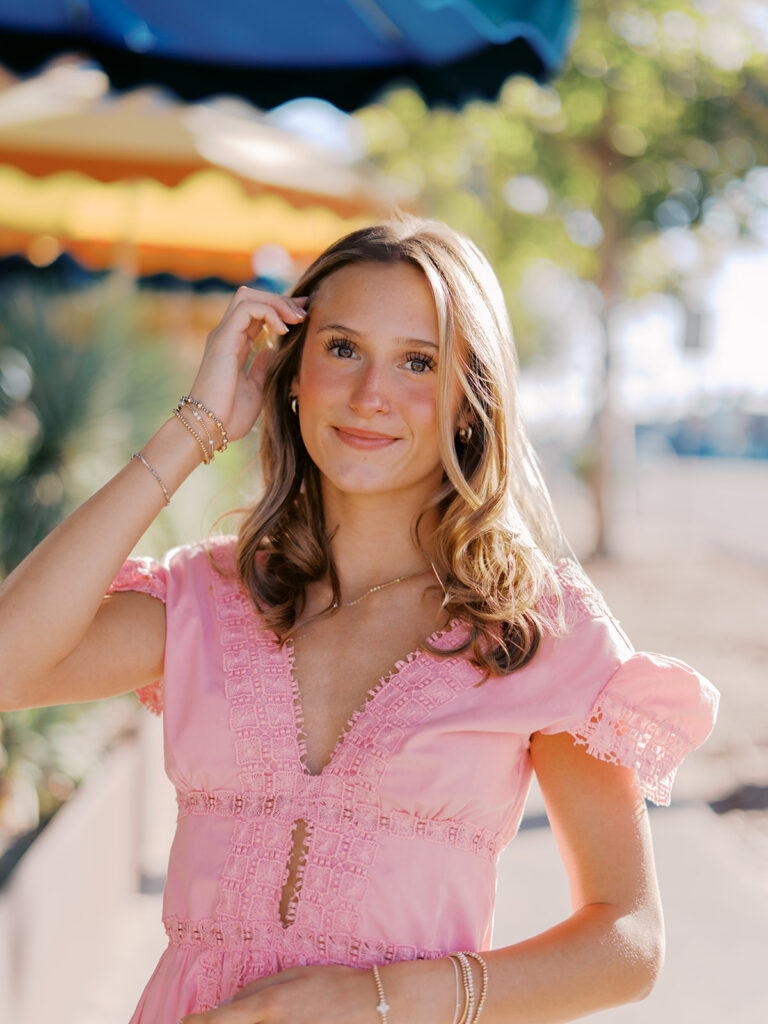 Austin senior photography session with golden sunlight and city views on South Congress