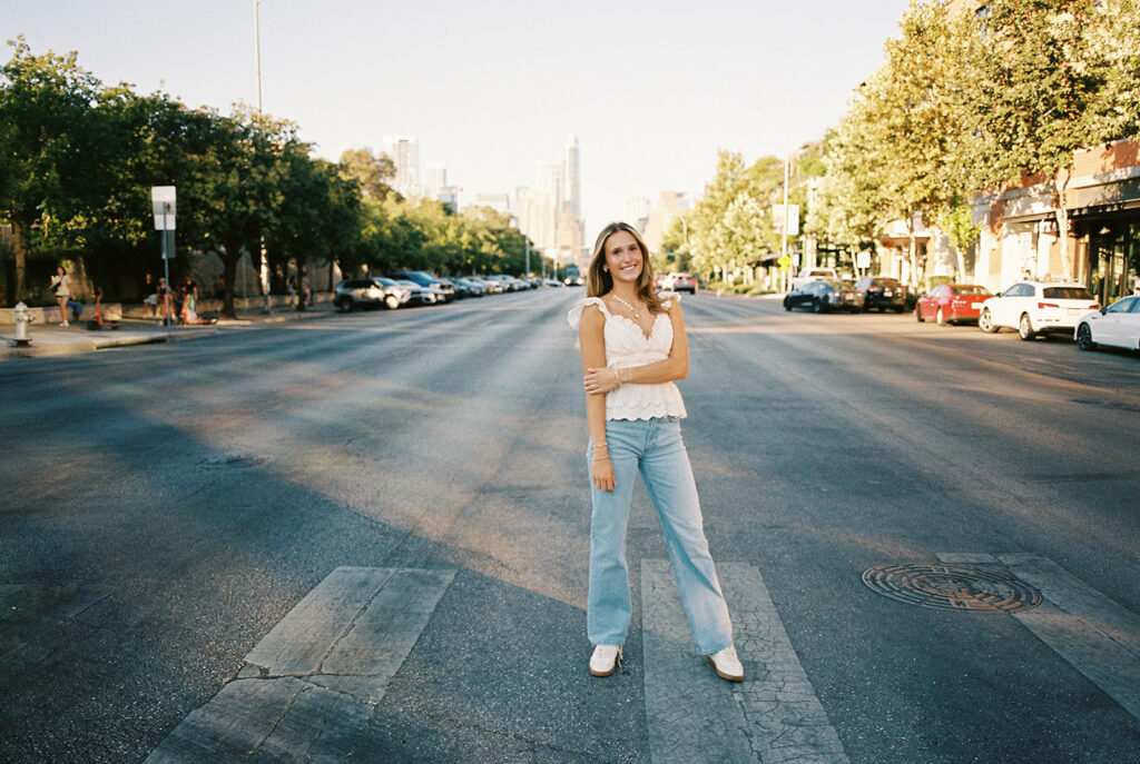 Joyful Austin senior photo on South Congress at golden hour on film