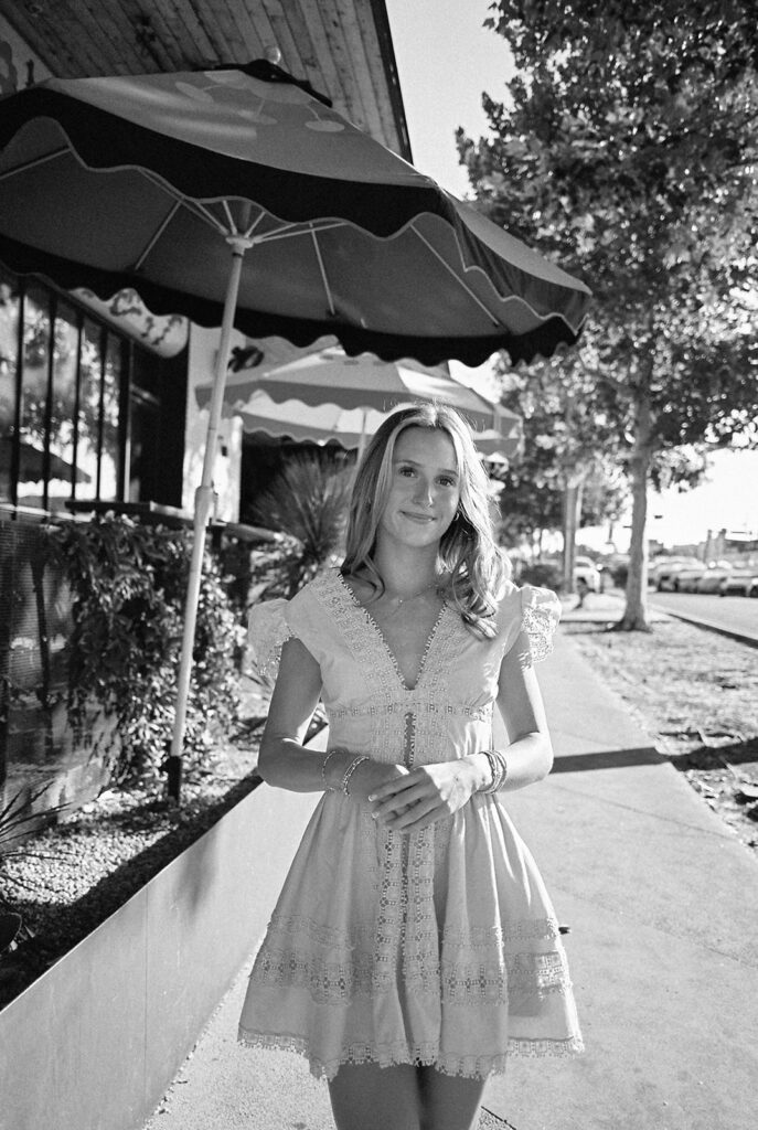 Austin senior photography session with golden sunlight and city views on South Congress