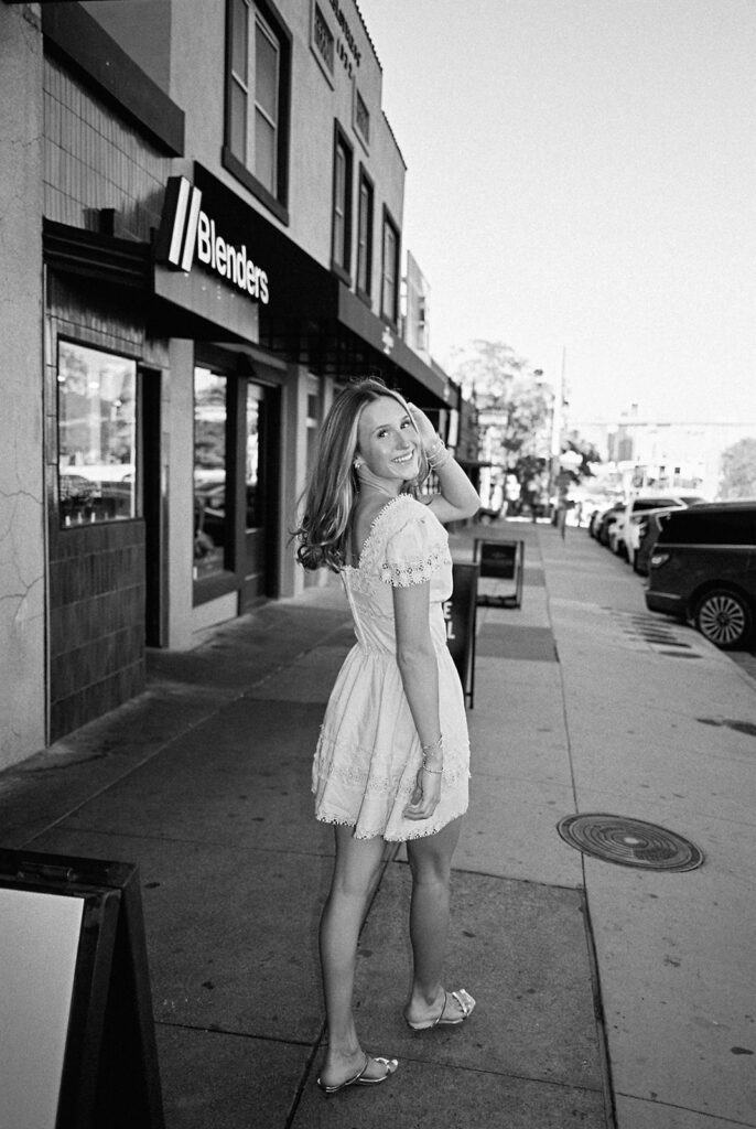 Austin senior photography session with golden sunlight and city views on South Congress