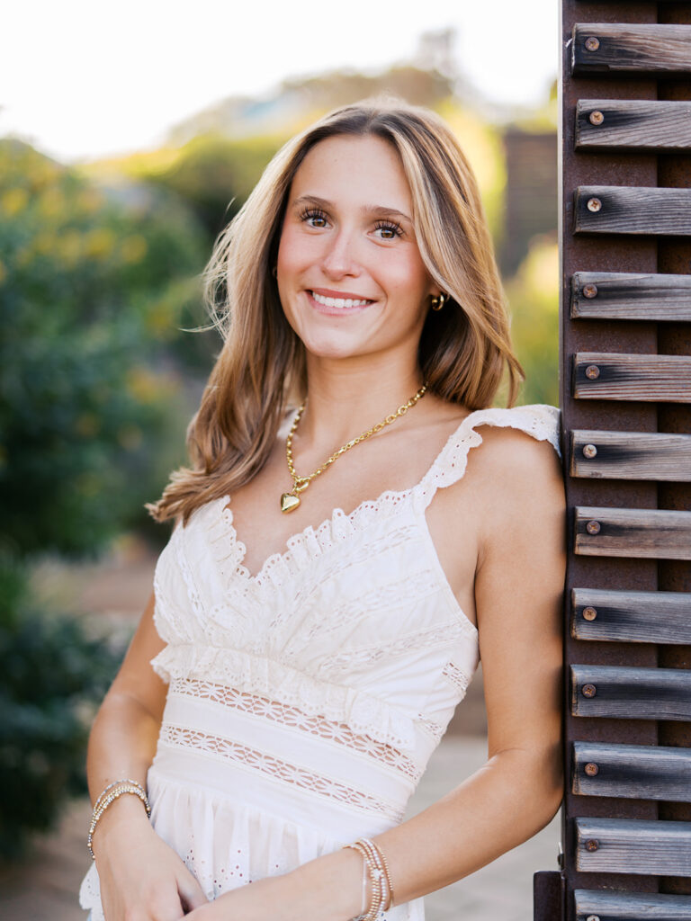 Austin senior photography session with golden sunlight and city views on South Congress