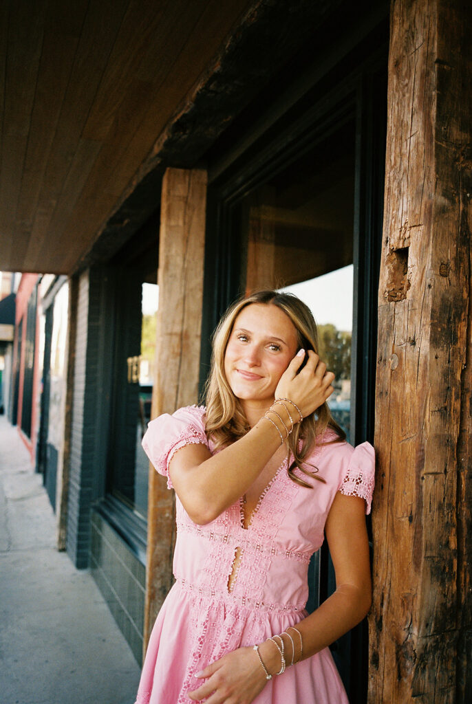 Austin senior photography session with golden sunlight and city views on South Congress