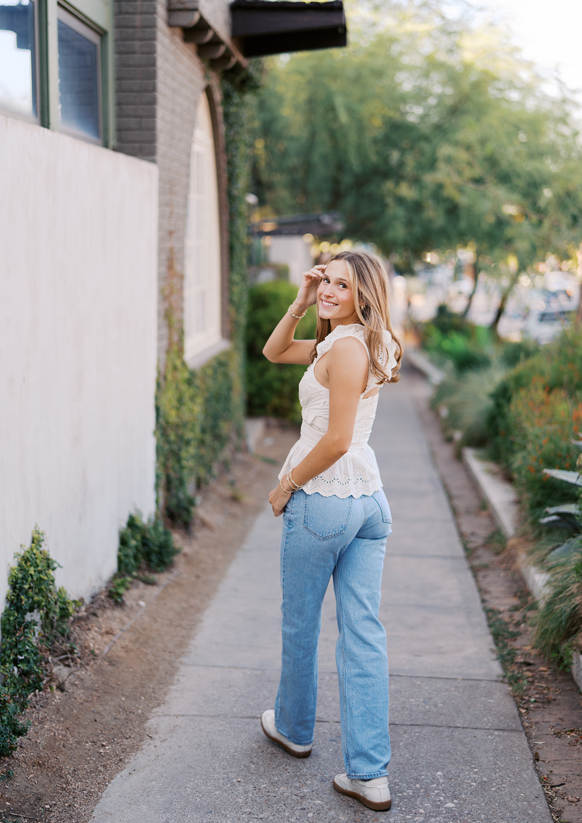 Joyful Austin senior photo on South Congress at golden hour on film