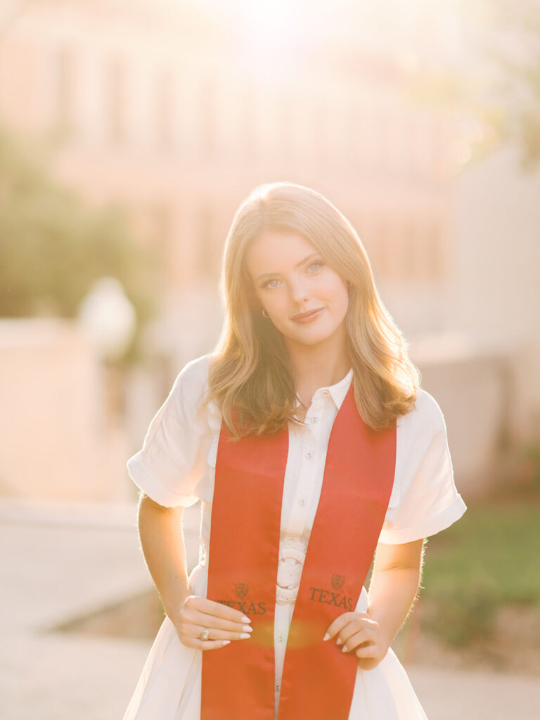University of Texas grad photos around the UT Austin campus, capturing timeless senior portraits filled with light, laughter, and celebration on film