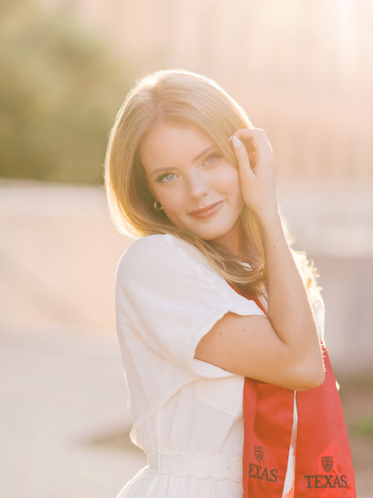 University of Texas grad photos around the UT Austin campus, capturing timeless senior portraits filled with light, laughter, and celebration on film