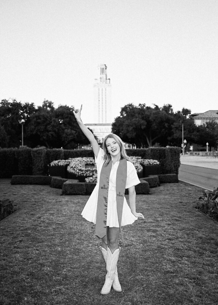 University of Texas senior photos at the UT Tower with cap and gown, timeless graduation portraits by Austin photographer Kelsey Applebaum on film