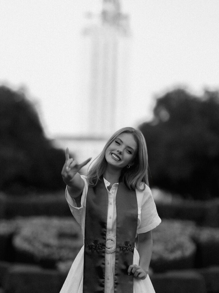 University of Texas senior photos at the UT Tower with cap and gown, timeless graduation portraits by Austin photographer Kelsey Applebaum on film