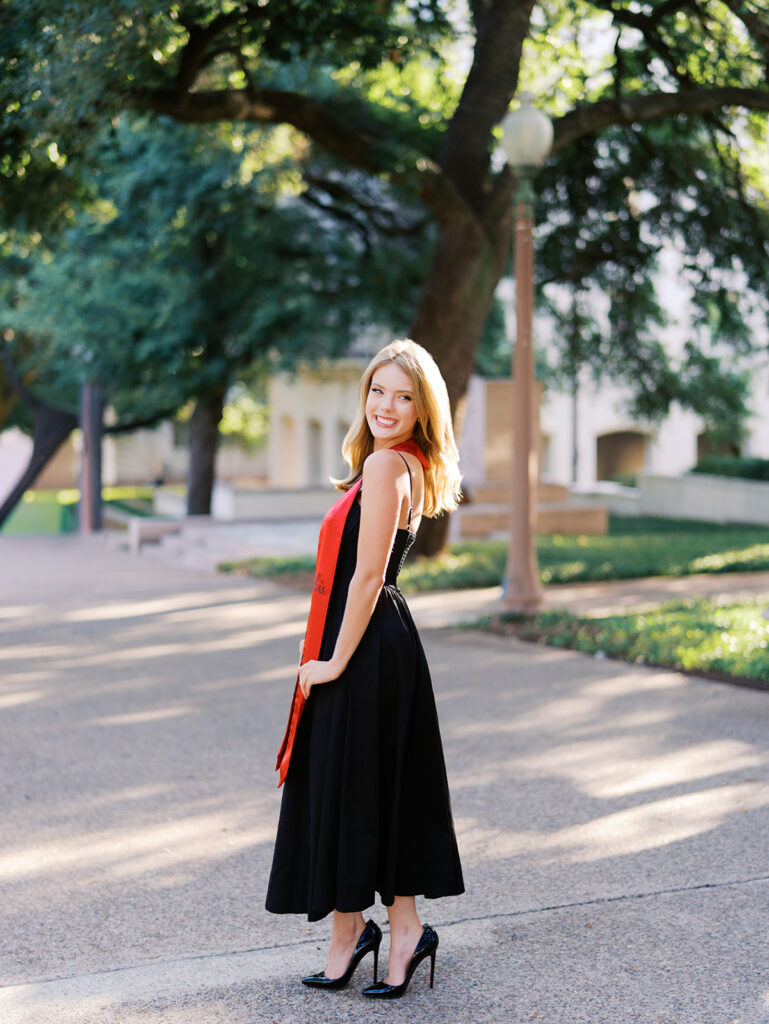 University of Texas grad photos around the UT Austin campus, capturing timeless senior portraits filled with light, laughter, and celebration on film