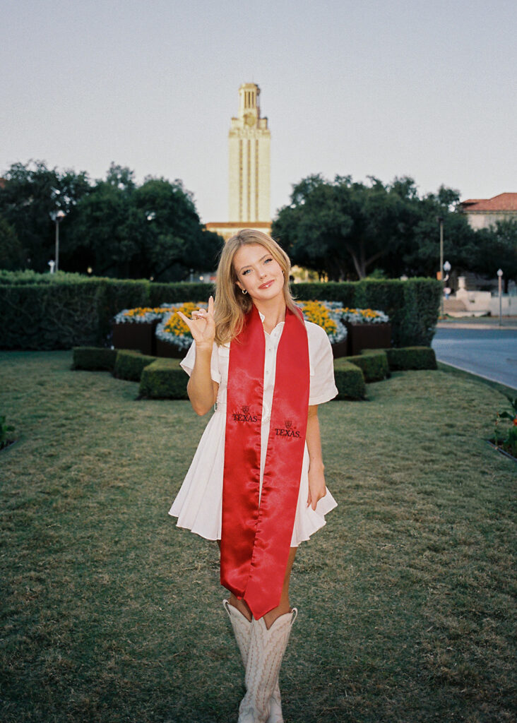 University of Texas senior photos at the UT Tower with cap and gown, timeless graduation portraits by Austin photographer Kelsey Applebaum on film