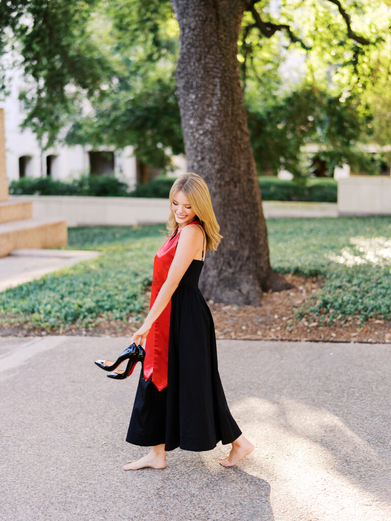 University of Texas grad photos around the UT Austin campus, capturing timeless senior portraits filled with light, laughter, and celebration on film
