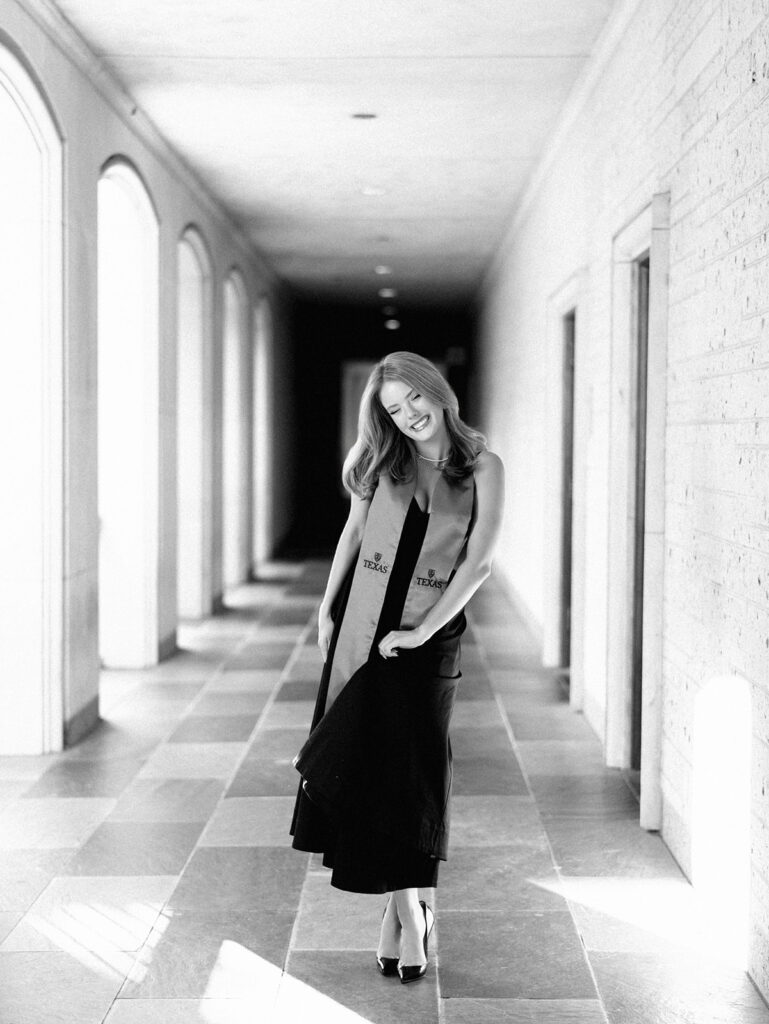 University of Texas grad photos around the UT Austin campus, capturing timeless senior portraits filled with light, laughter, and celebration on film