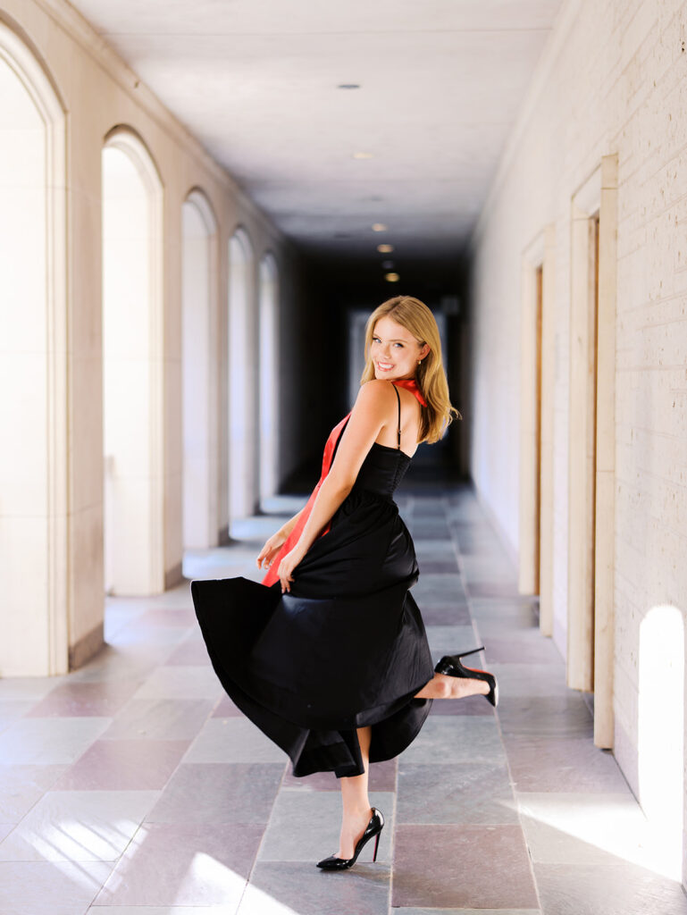 University of Texas grad photos around the UT Austin campus, capturing timeless senior portraits filled with light, laughter, and celebration on film