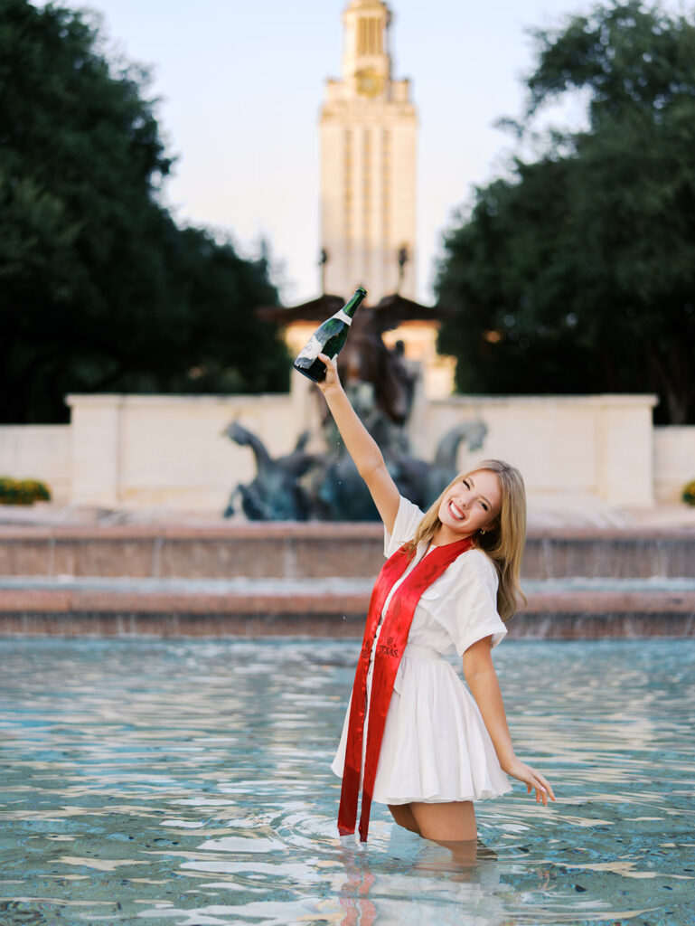 UT Austin grad photos at Littlefield Fountain during golden hour, capturing joyful senior portraits full of color and celebration.