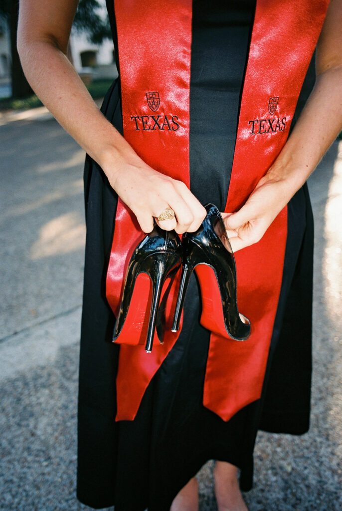 University of Texas grad photos around the UT Austin campus, capturing timeless senior portraits filled with light, laughter, and celebration on film