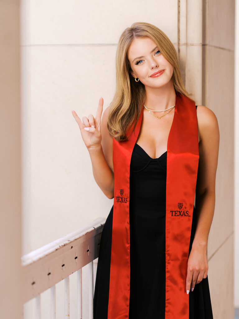 University of Texas grad photos around the UT Austin campus, capturing timeless senior portraits filled with light, laughter, and celebration on film