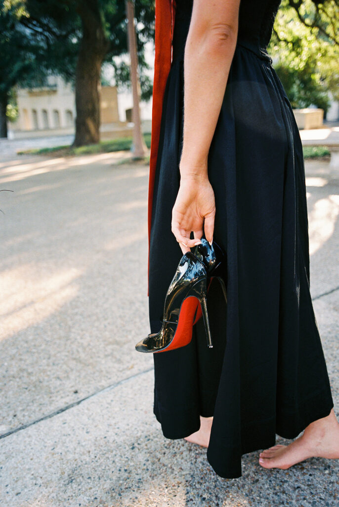 University of Texas grad photos around the UT Austin campus, capturing timeless senior portraits filled with light, laughter, and celebration on film