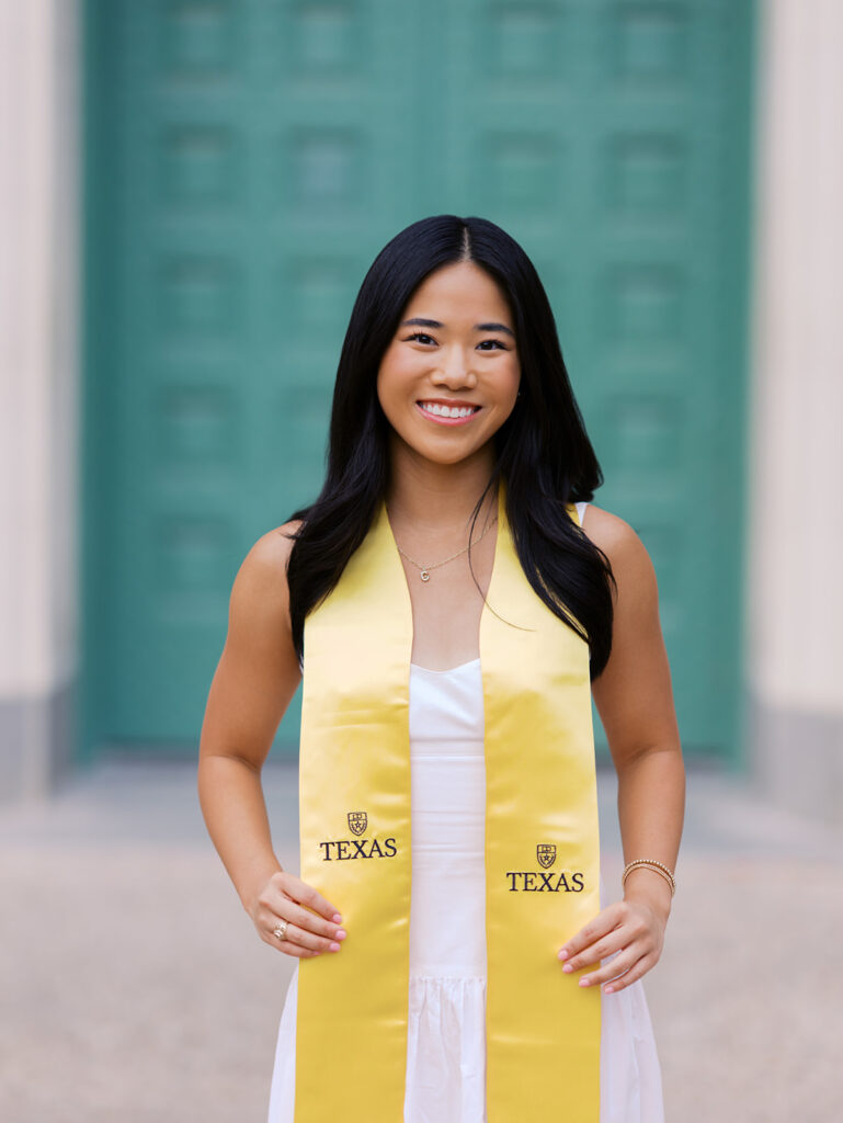 Texas Longhorn senior photos in front of the UT Tower at sunset
