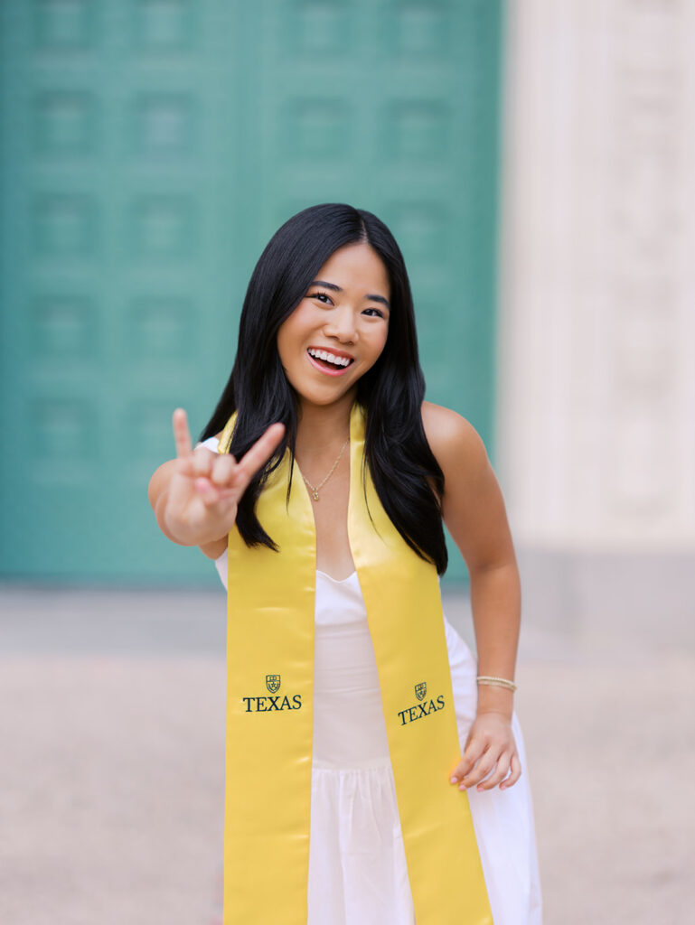 Texas Longhorn senior photos in front of the UT Tower at sunset
