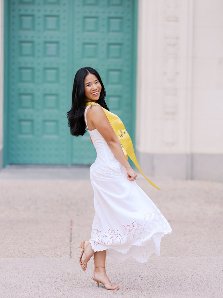 Texas Longhorn senior photos in front of the UT Tower at sunset