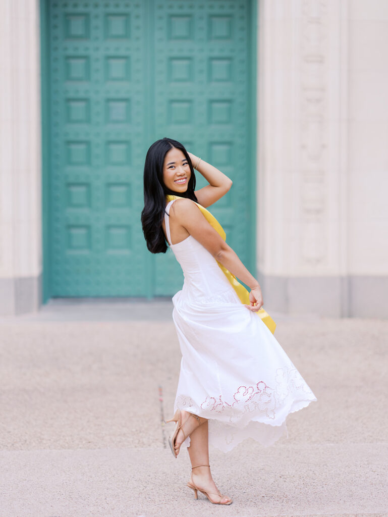 Texas Longhorn senior photos in front of the UT Tower at sunset