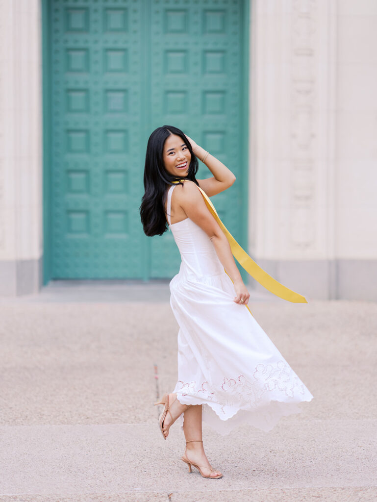 Texas Longhorn senior photos in front of the UT Tower at sunset