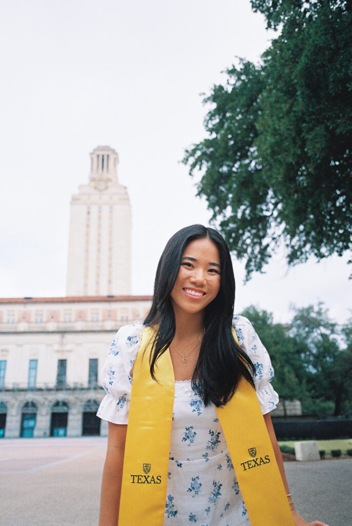 Texas Longhorn senior photos in front of the UT Tower at sunset