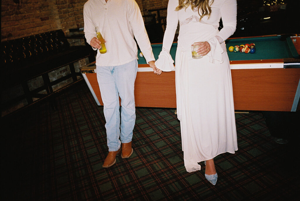 Chris and Reagan enjoying an indoor engagement session at Seven Grand Austin