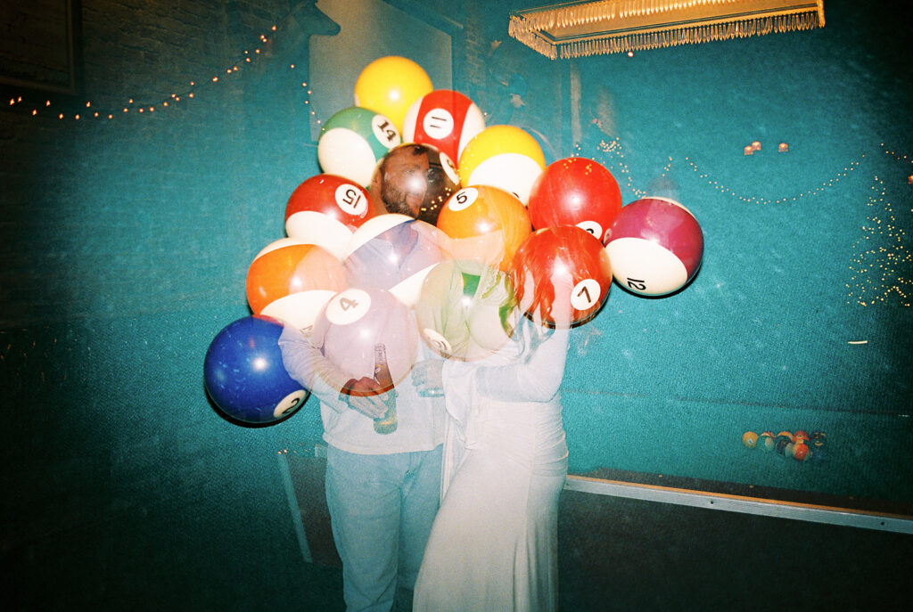 Chris and Reagan enjoying an indoor engagement session at Seven Grand Austin