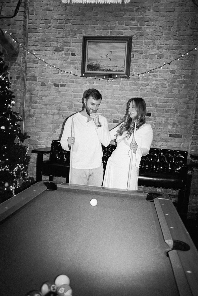 Chris and Reagan enjoying an indoor engagement session at Seven Grand Austin