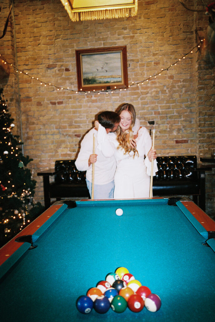 Chris and Reagan enjoying an indoor engagement session at Seven Grand Austin