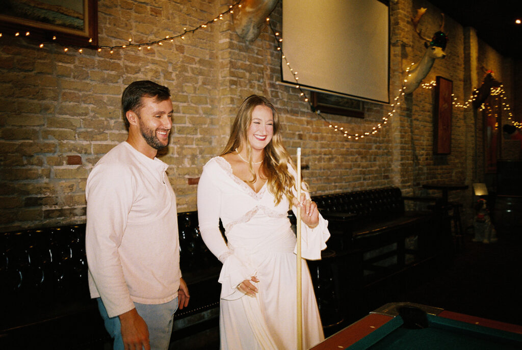 Chris and Reagan enjoying an indoor engagement session at Seven Grand Austin