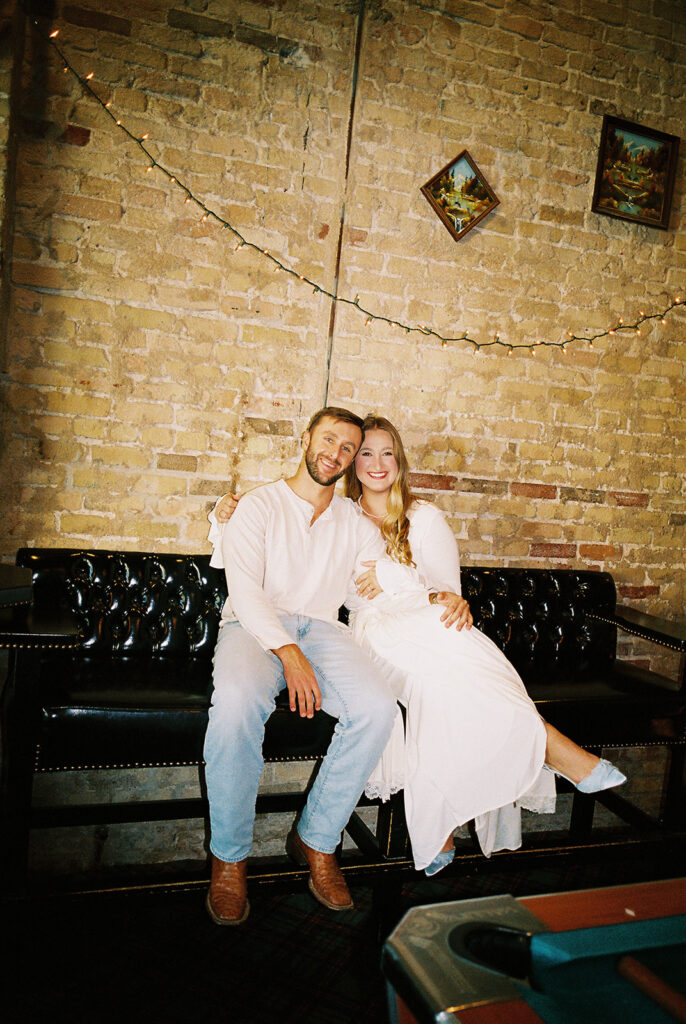 Film engagement photos at a dive bar in Austin, Texas