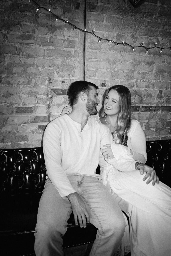 Film engagement photos at a dive bar in Austin, Texas