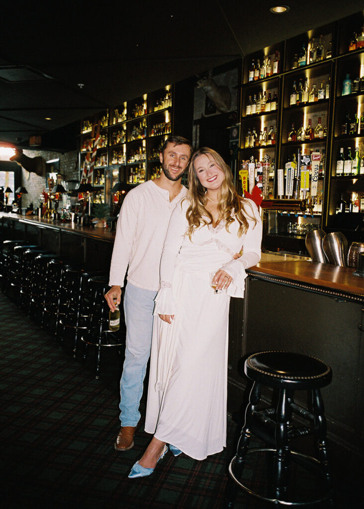 Film engagement photos at a dive bar in Austin, Texas