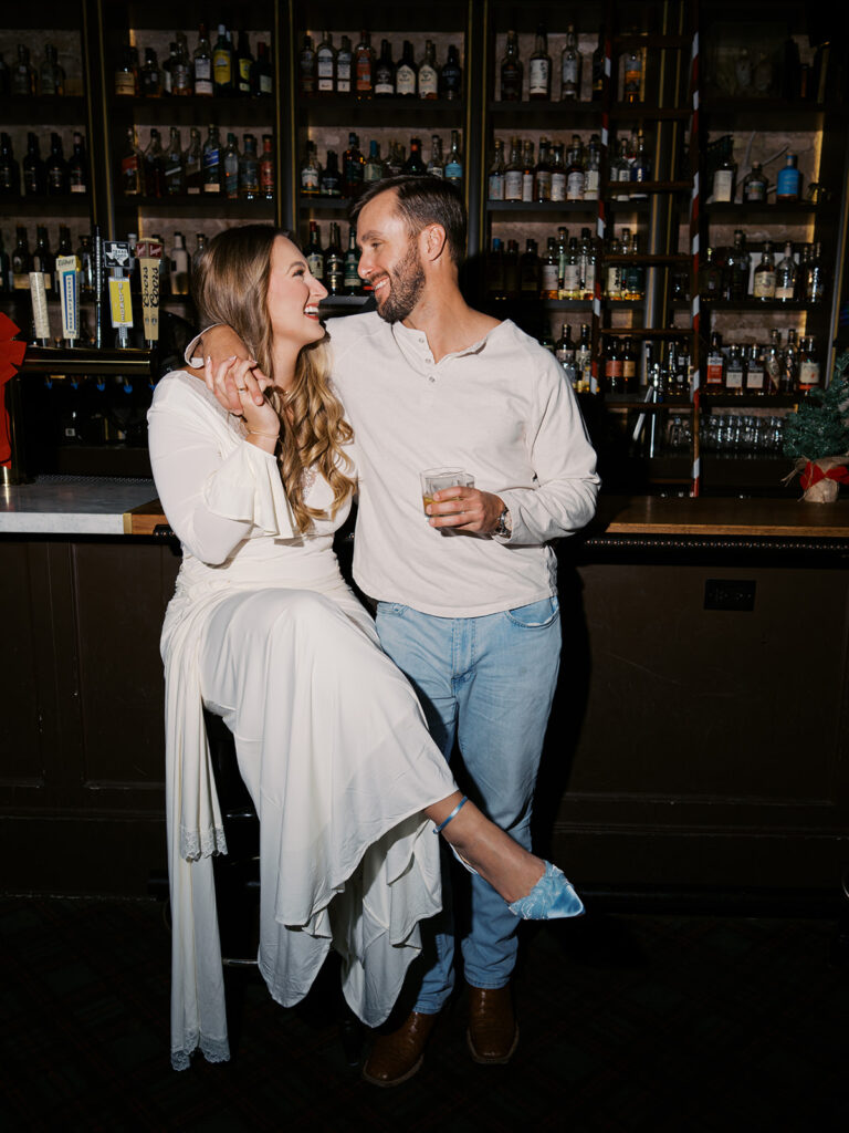 Film engagement photos at a dive bar in Austin, Texas