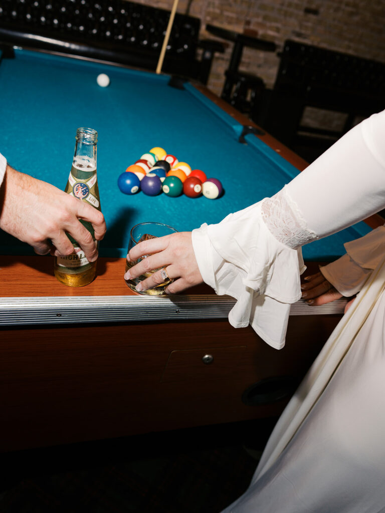 Film photography engagement session in a dark and moody Austin bar