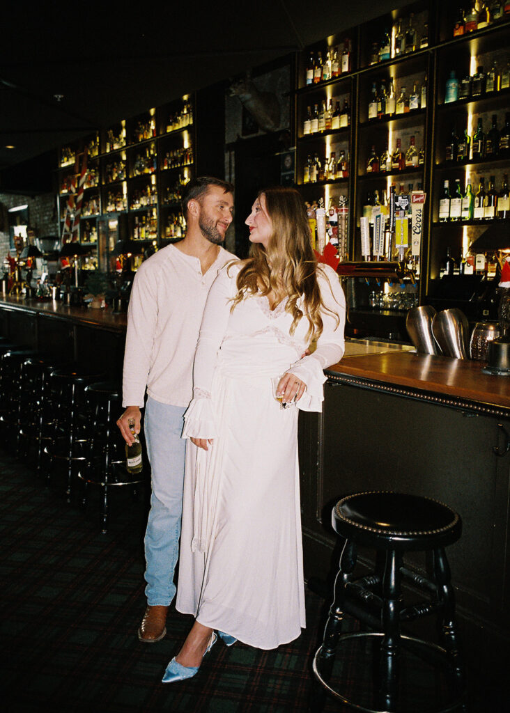 Film engagement photos at a dive bar in Austin, Texas