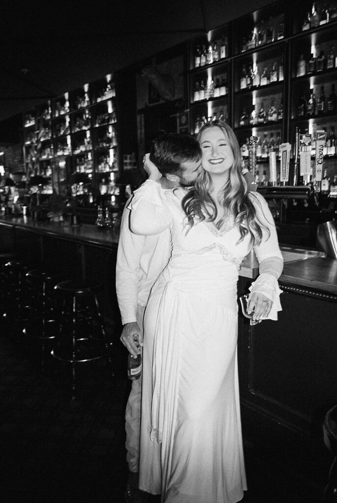 Film engagement photos at a dive bar in Austin, Texas