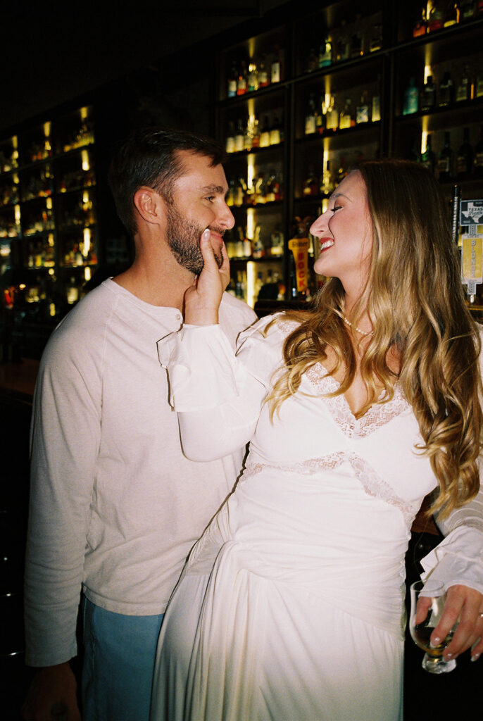 Film engagement photos at a dive bar in Austin, Texas