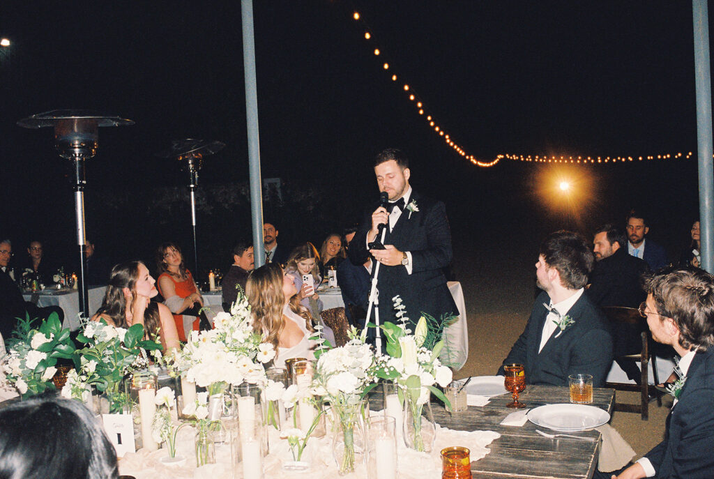 Joyful wedding reception with dancing at Springdale Station on film