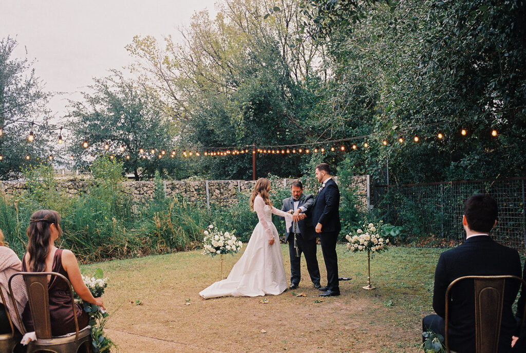 Outdoor wedding ceremony at Springdale Station on a November day on film