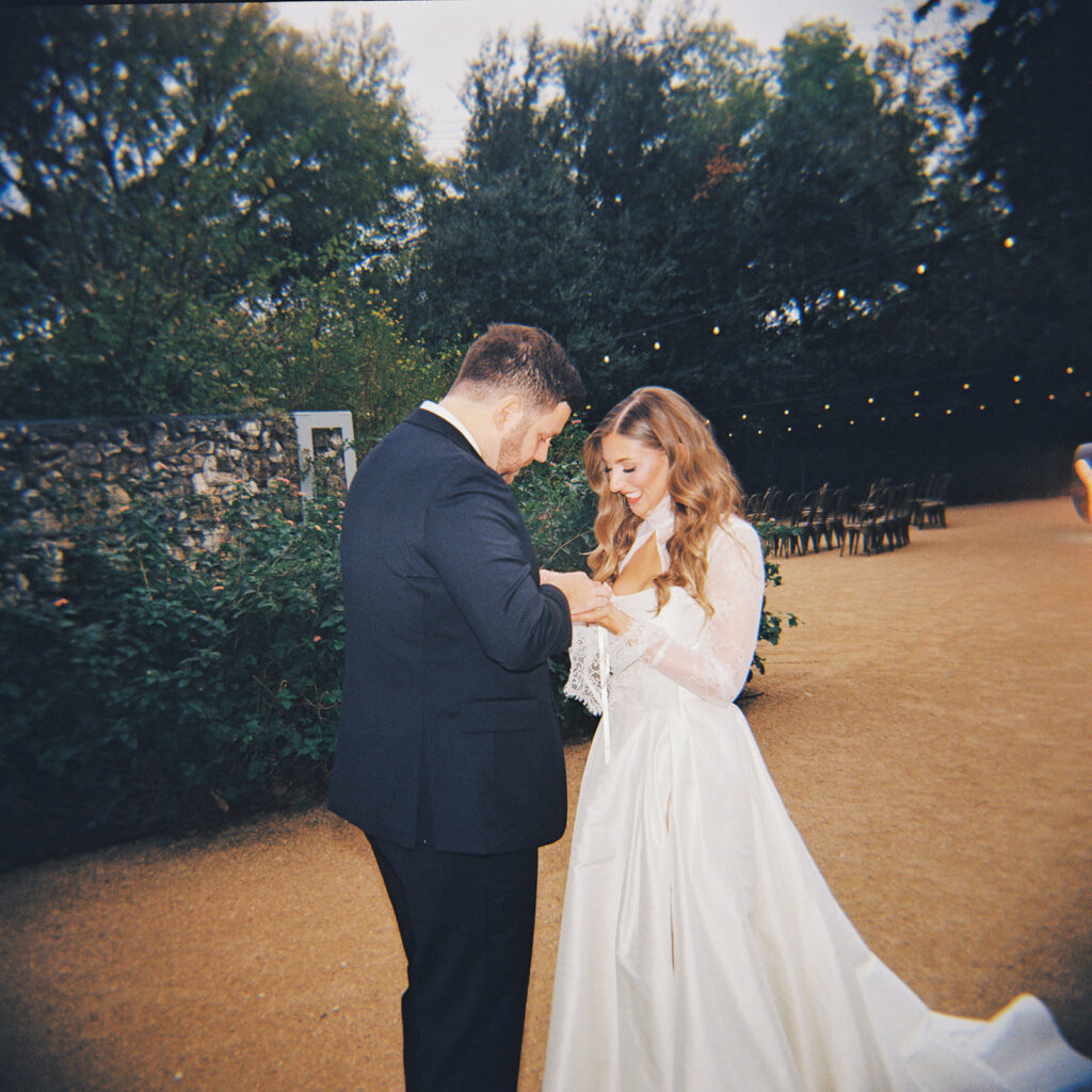Emotional first look during an intimate wedding in Austin, Texas photographed on film