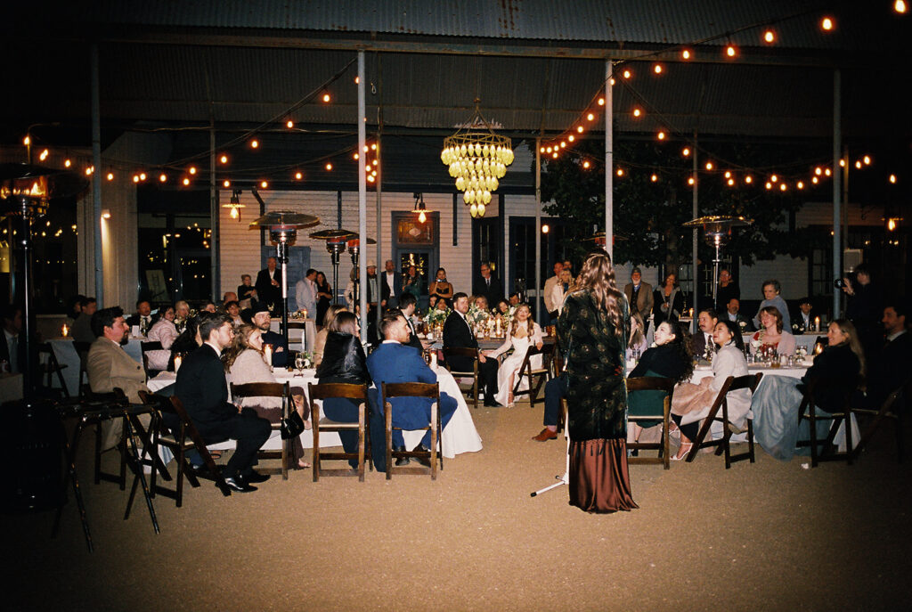 Joyful wedding reception with dancing at Springdale Station on film