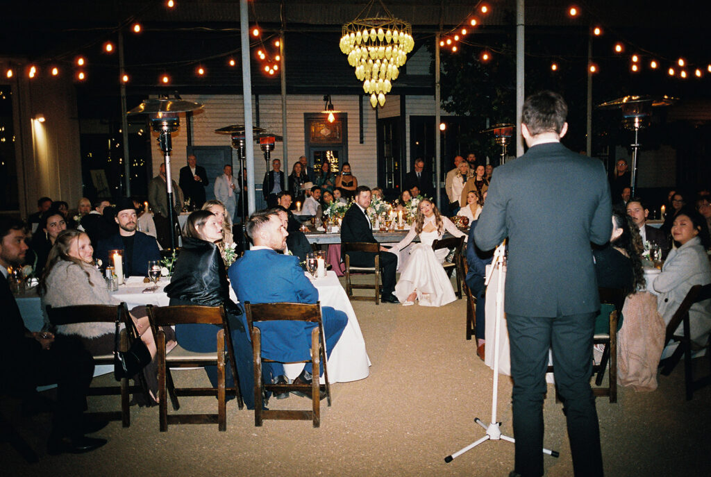 Joyful wedding reception with dancing at Springdale Station on film